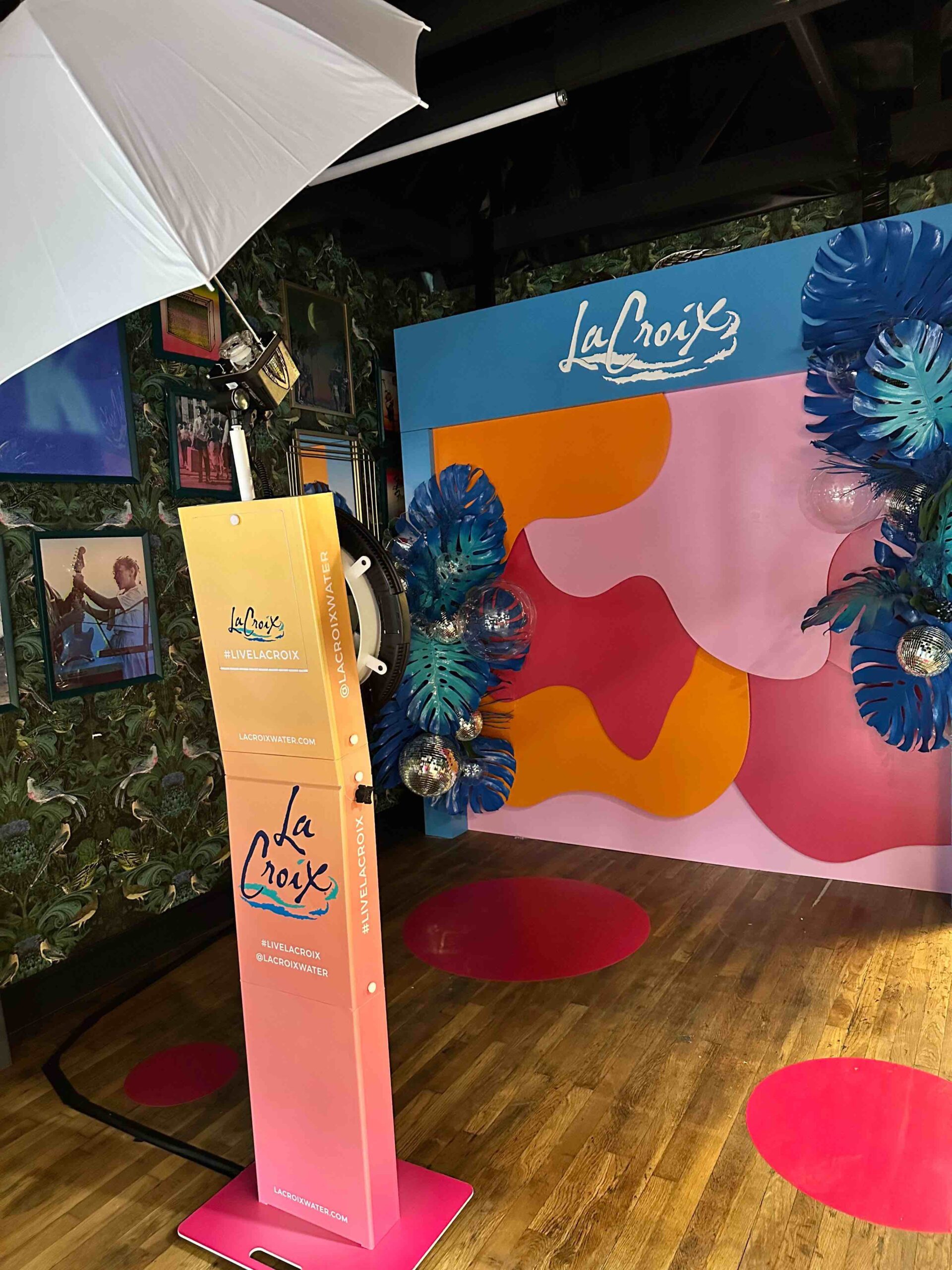 Colorful photobooth at La Croix event featuring pinks, oranges and blues